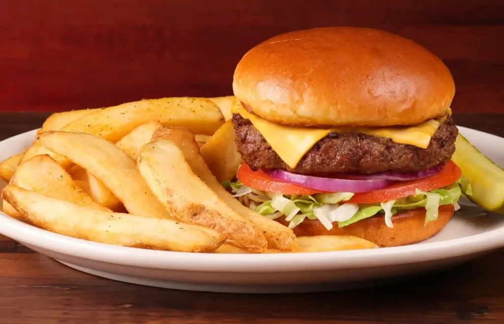 Texas Roadhouse burger on plate served with crispy fries