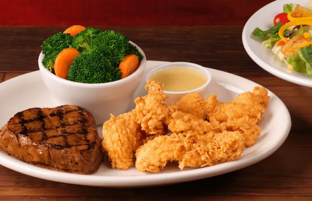 Tender sirloin and brown chicken critters served sauce and broccoli