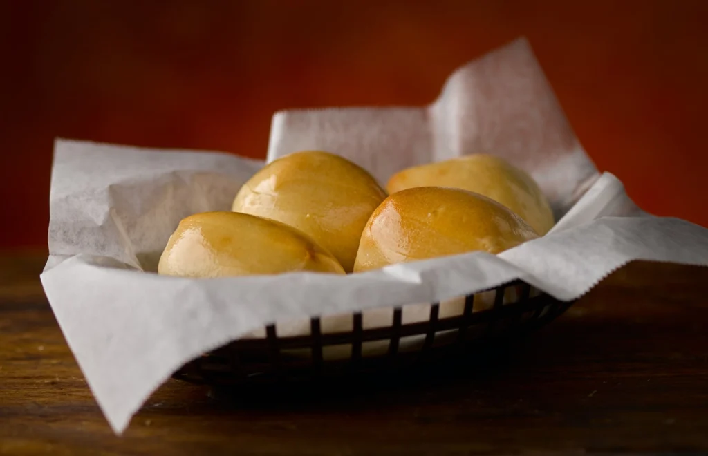 Restaurant basket filled with fresh-baked breads