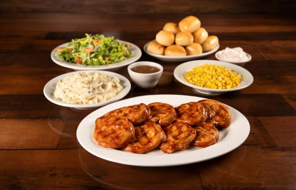 Family-sized BBQ chicken with mashed potato, dip sauce, corn and salad 