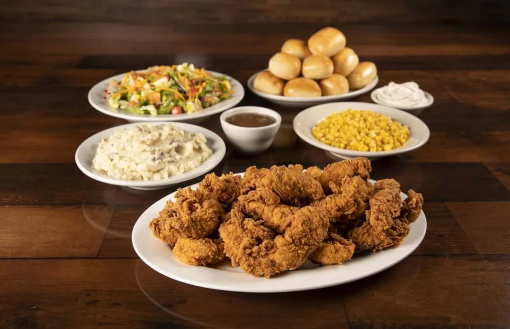 Family-sized chicken critters served with mashed potatoes, buttery corn, baked breads, and salad.