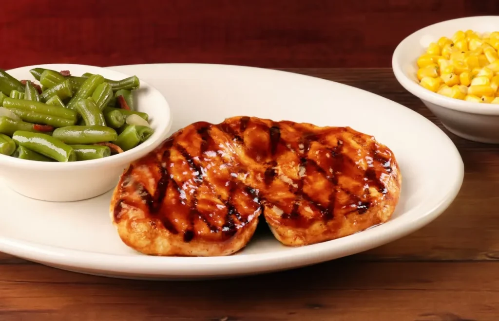 Tender grilled chicken breasts served warm with green beans