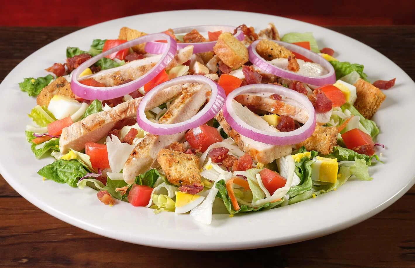 Grilled chicken salad with fresh greens and zesty vinaigrette