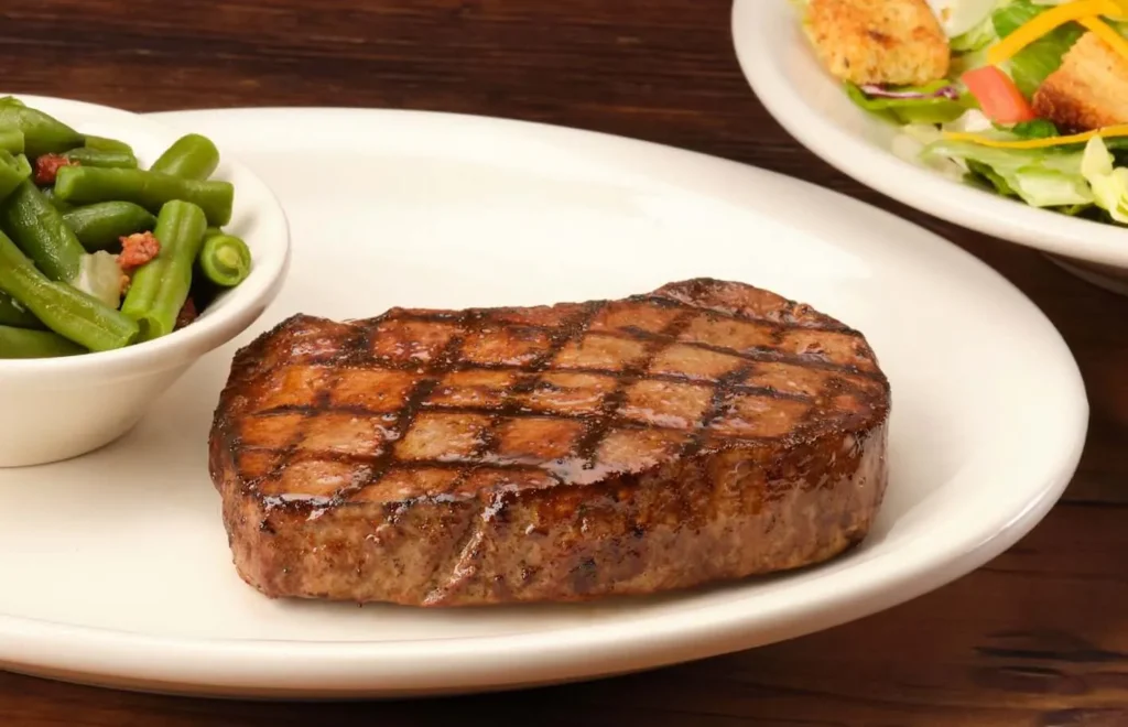 10 oz. USDA Choice Sirloin Steak served with green beans on the side