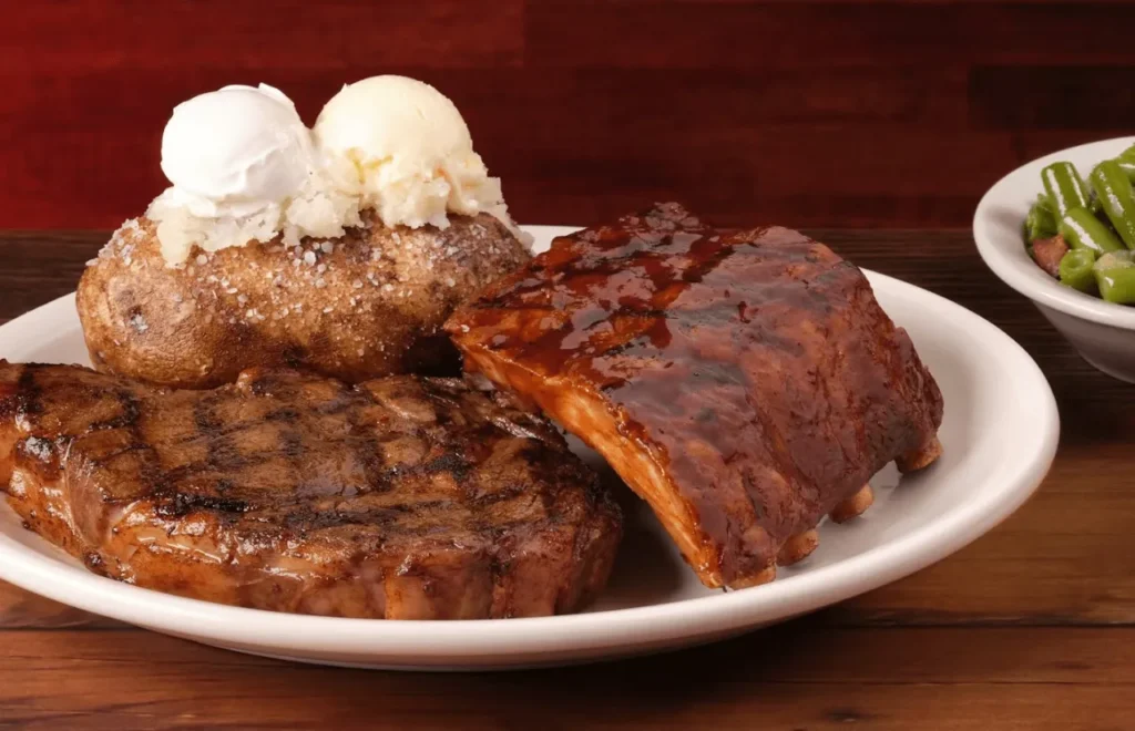 Tender ribeye with a slab of ribs, served with creamy baked potatoes