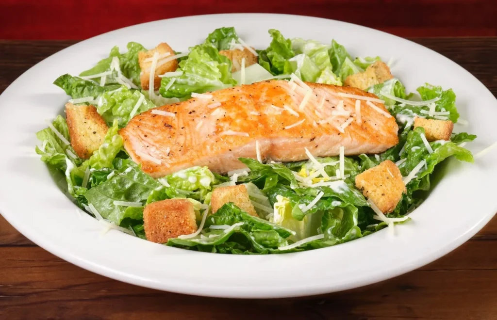 Salmon Caesar Salad with seared salmon, crisp romaine, creamy dressing