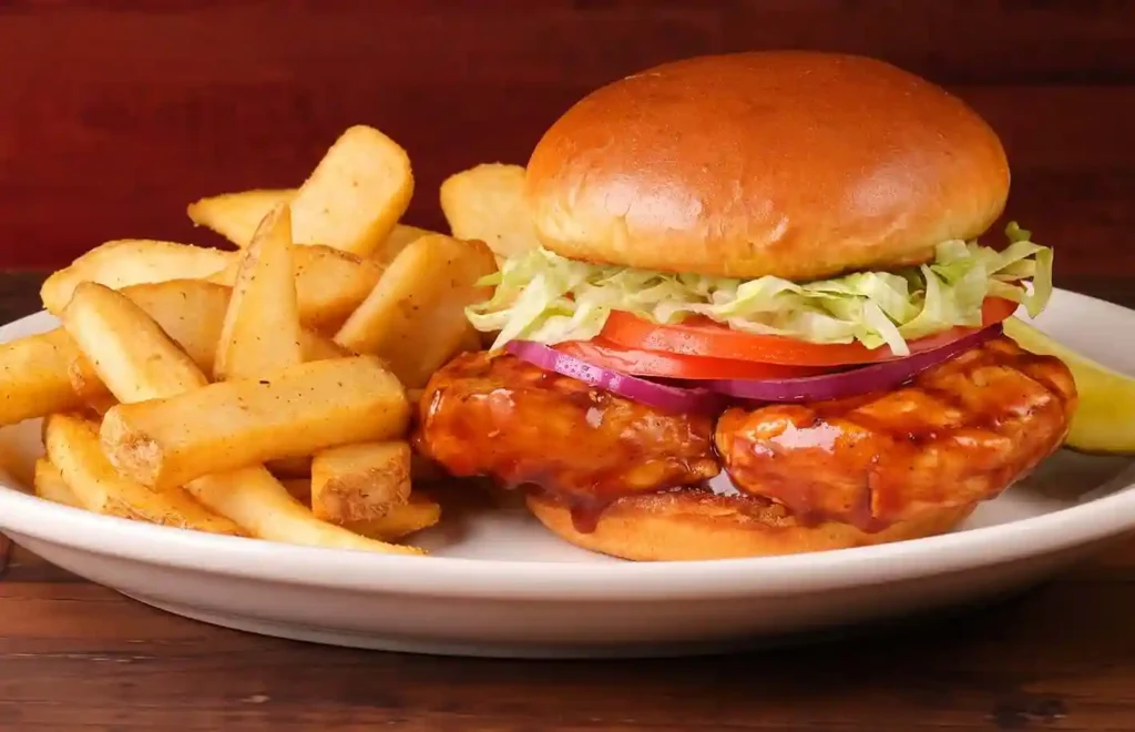 BBQ chicken sandwich with crispy fries 