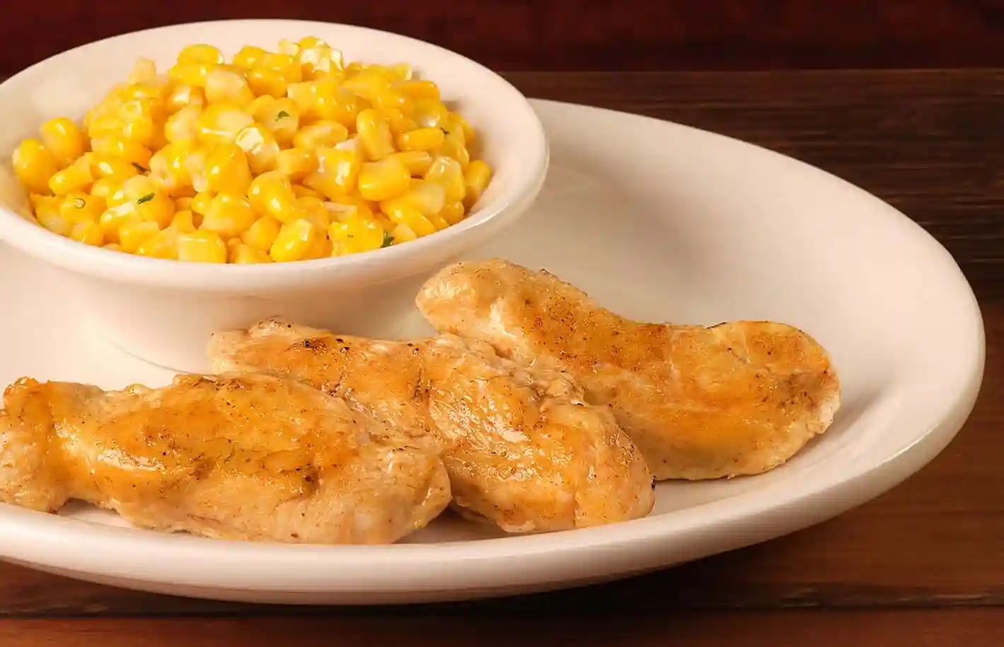 home page 83 Kids Grilled Chicken served with buttered corn
