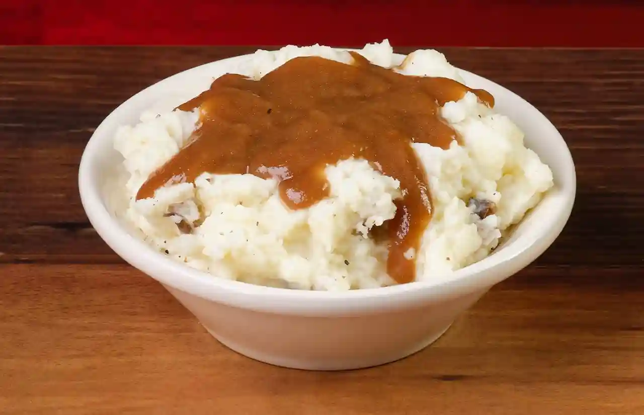 home page 66 Bowl of mashed potatoes with topping of brown gravy