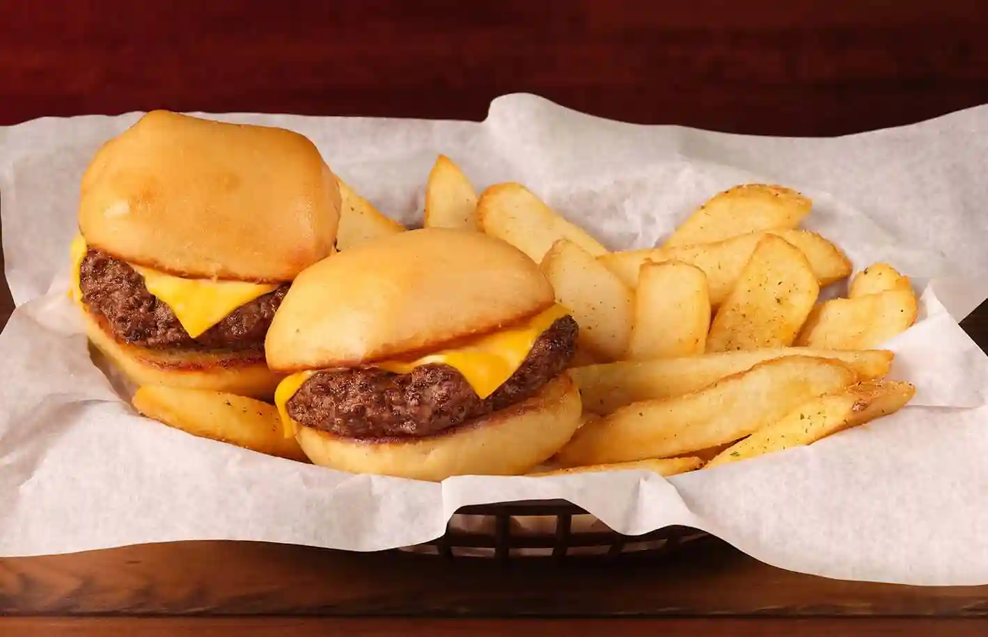 home page 81 Mini-Cheeseburgers served with fries in basket