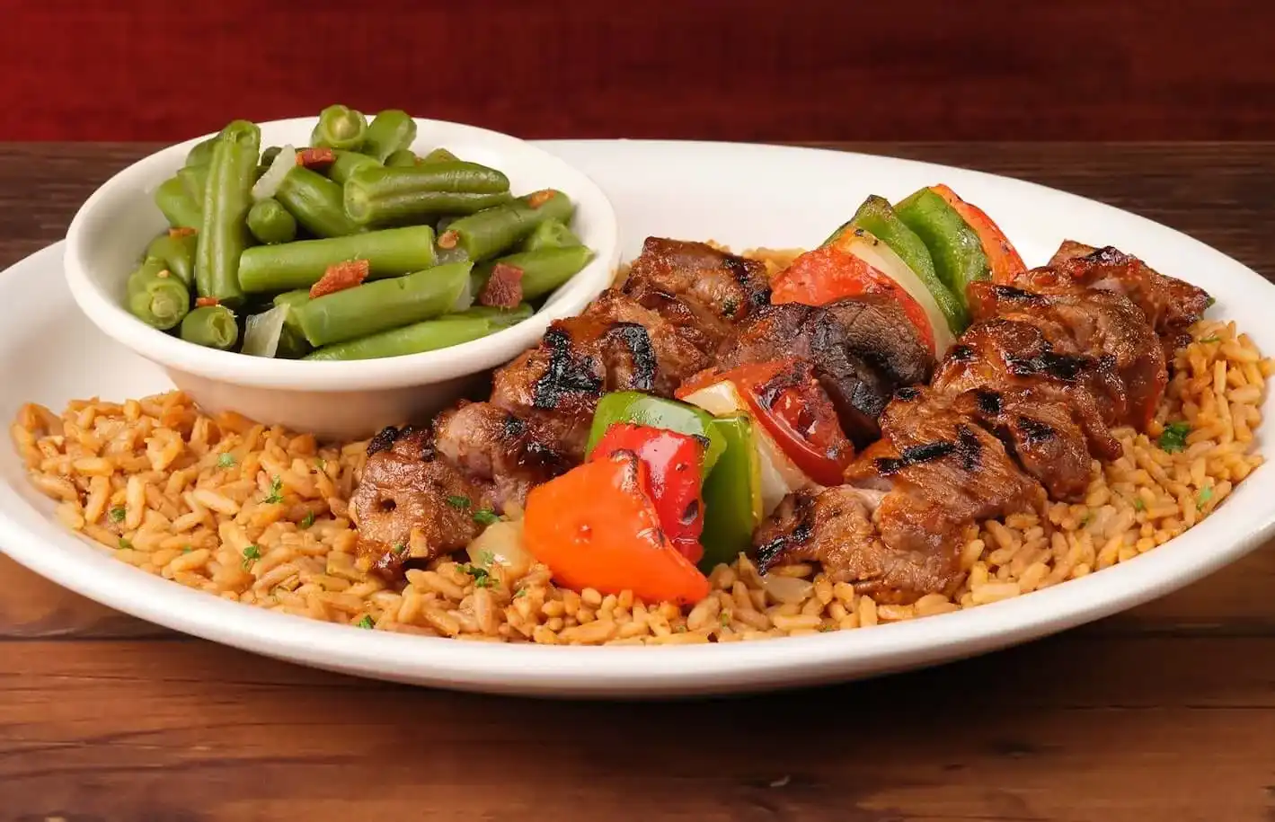 home page 25 Steak kabob served with rice and beans