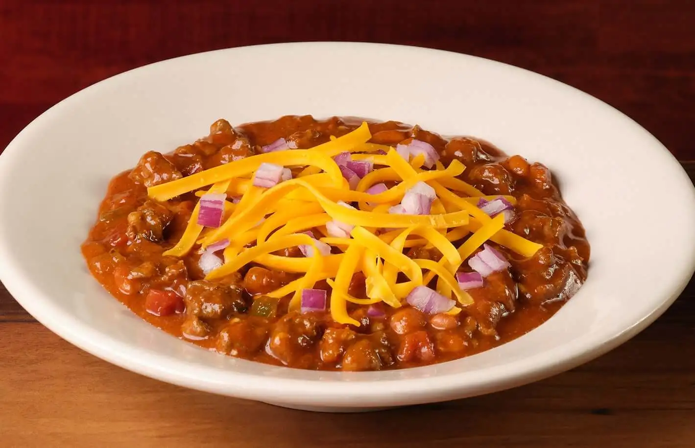 home page 10 Bowl of hearty Texas Red Chili topped with fresh